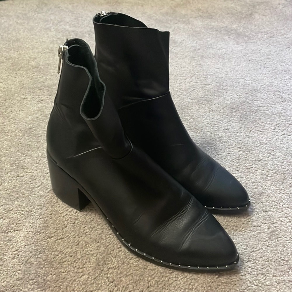 Black pointed toe boots w/ studded detailing